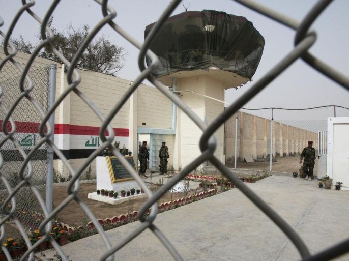 5e9c6d85-f060-47eb-aac3-a361ecbde526-1 FILE - In this Feb. 21, 2009 file photo, guards stand at the entrance of a renovated Abu Ghraib prison, now renamed Baghdad Central Prison and run by Iraqis, in Baghdad, Iraq. A military-style assault by al-Qaida leader Abu Bakr al-Baghdadi’s fighters on two Baghdad-area prisons in July, 2013 freed more than 500 inmates.(AP Photo / Karim Kadim, File)