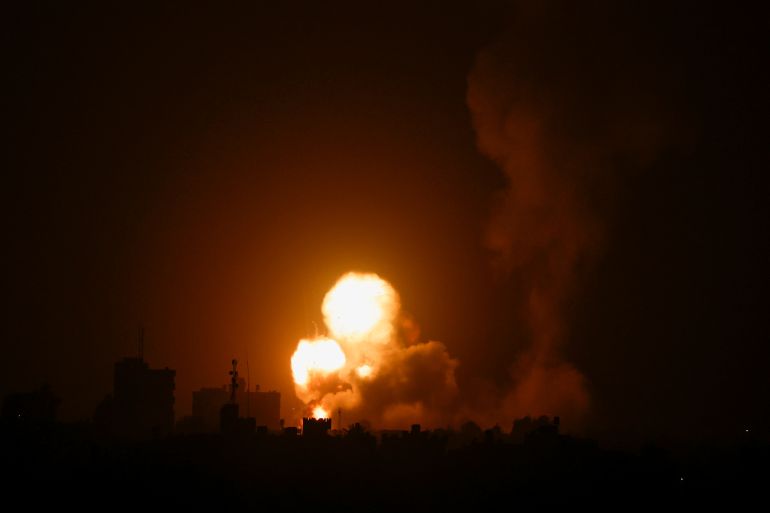 rts7676s-1 Flames and smoke rise during Israeli air strikes amid a flare-up of Israel-Palestinian violence, in the southern Gaza Strip
