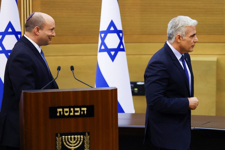 rts8uvhi Israeli Prime Minister Naftali Bennett and Foreign Minister Yair Lapid give a statement, in Jerusalem