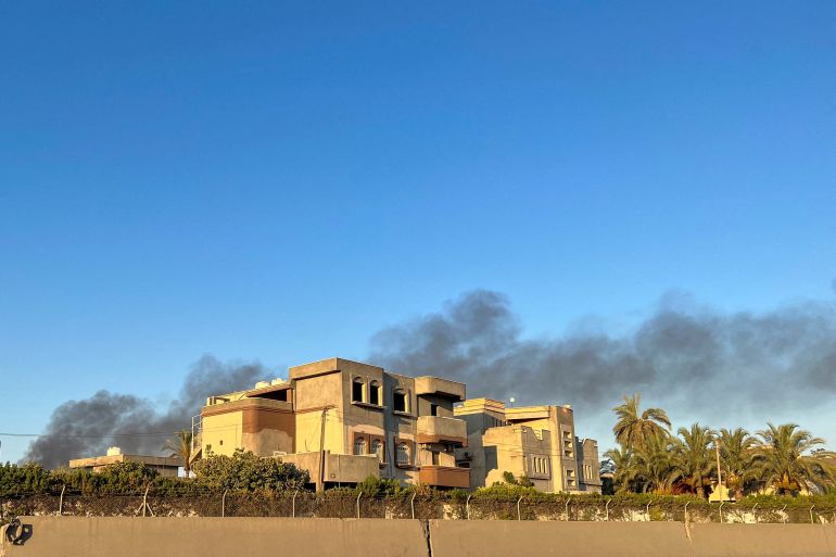 rts9sl8m-1 Smoke rises in the sky following clashes in Tripoli