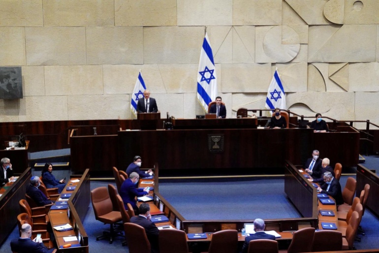 rtx7jba6 Benny Gantz, centrist Blue and White leader, and Israeli Prime Minister Benjamin Netanyahu's partner in his new unity government, speaks during a swearing in ceremony of the new government, at the Knesset, Israel's parliament, in Jerusalem