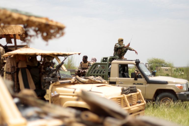 rtxi61hd-1 Malian soldiers are pictured during a patrol with soldiers from the new Takuba force near Niger border in Dansongo Circle